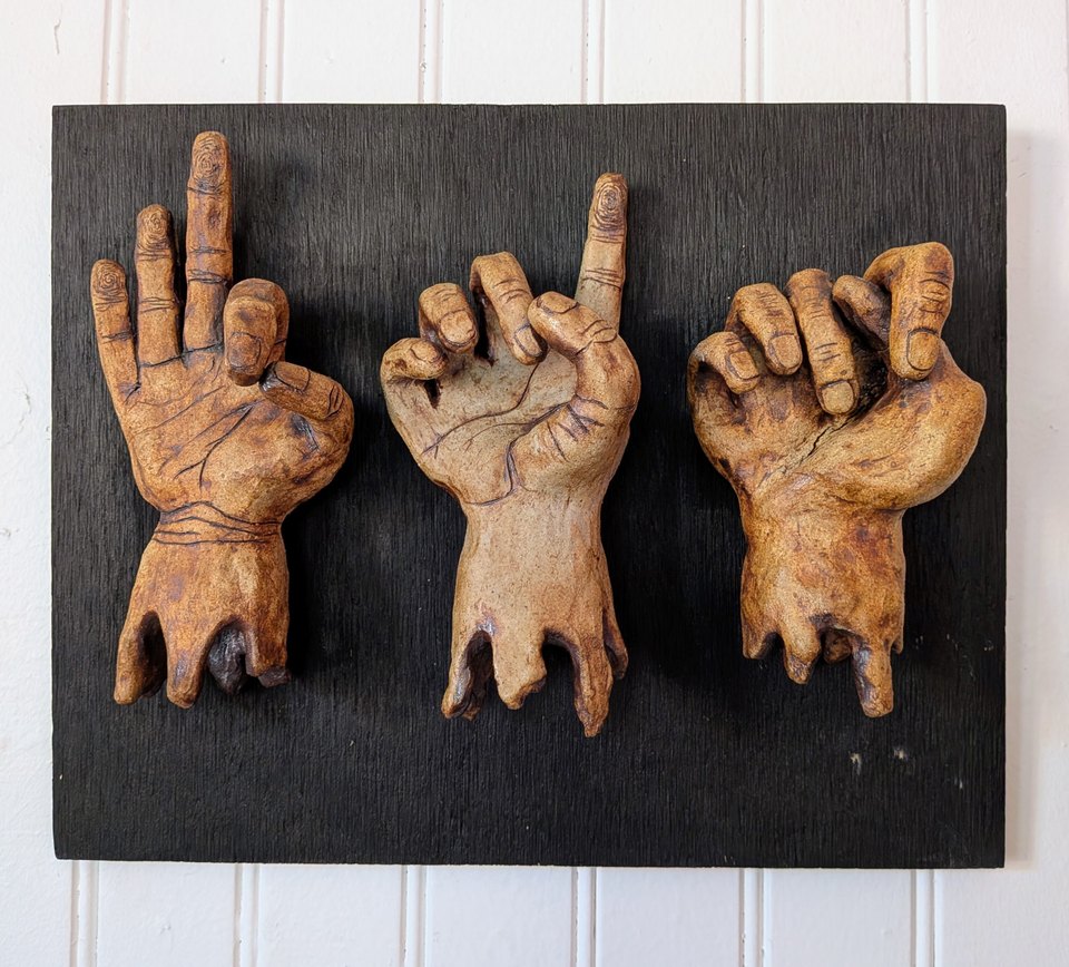 Three melted, rough, stained hands spelling F.D.T in American Sign Language. Three Hands. Three Letters. One message. Fuck Donald Trump.