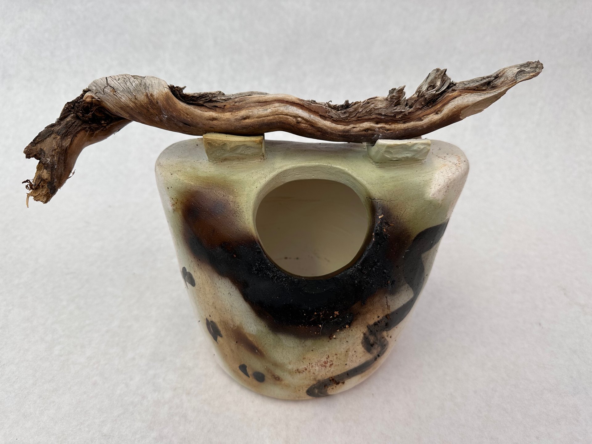 Saggar vase with live wood as the handle
